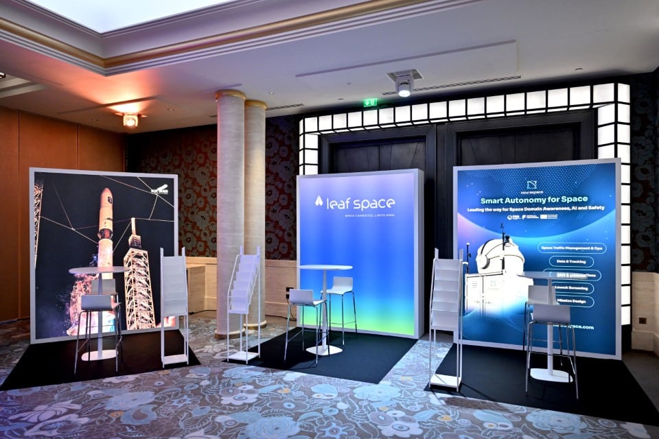 Exhibition area featuring three branded company stands